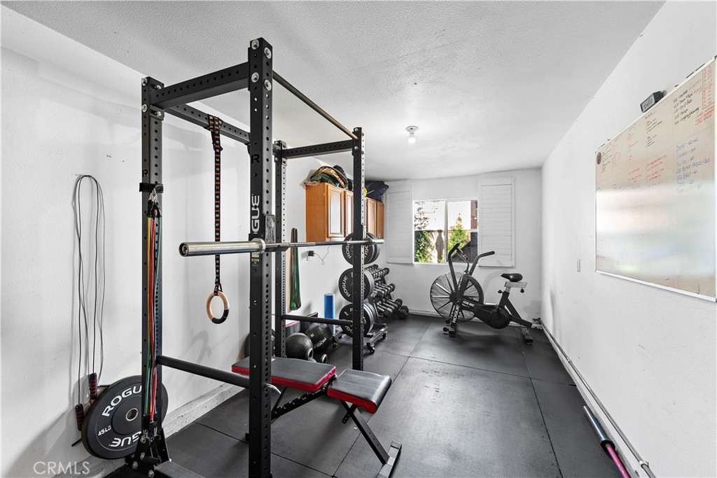 4314 Silver Spring Way Oceanside, CA 92057 - Photo 32 of 49 a view of a room with gym equipment