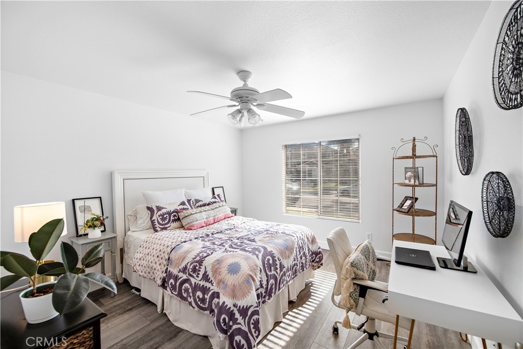 4314 Silver Spring Way Oceanside, CA 92057 - Photo 4 of 49 a bedroom with a bed and a chandelier