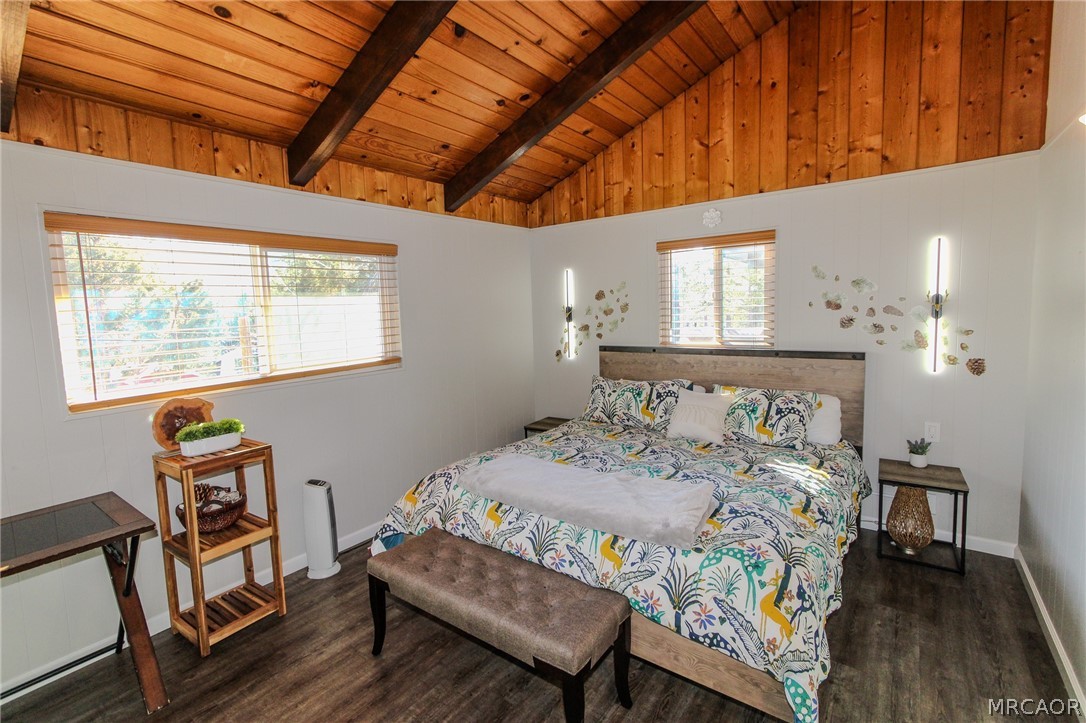 42830 Cougar Road, Unit UPPR Big Bear Lake, CA 92315 - Photo 8 of 21 a bedroom with a bed a table and chair