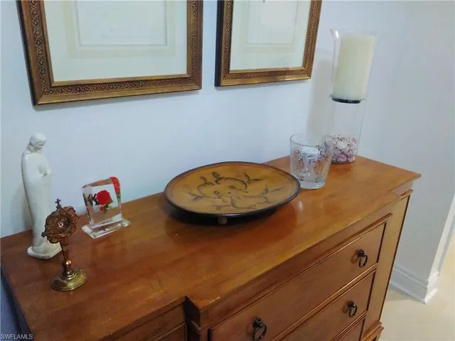 a view of a dining room with a table and wooden floor