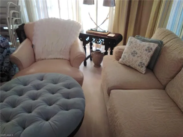 a view of livingroom with furniture and window