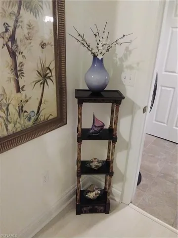 a room with wooden floor and furniture