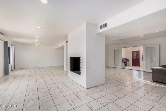 a view of a room with window and mirror