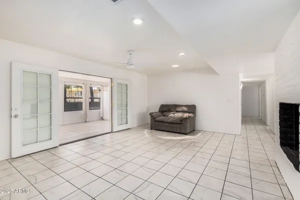 a view of an empty room with a fireplace