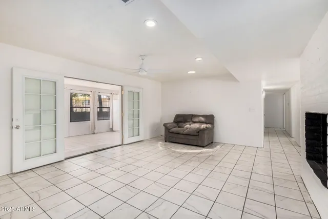 a view of an empty room with a fireplace