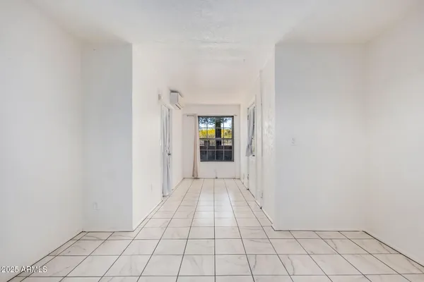 a white toilet sitting next to a shower curtain
