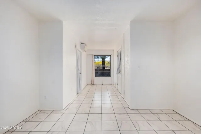 a white toilet sitting next to a shower curtain
