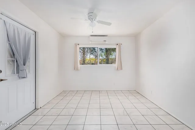 a kitchen with white cabinets and appliances