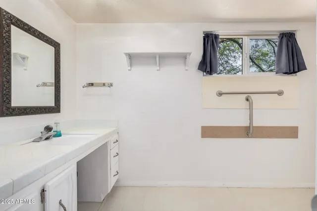 a view of a backyard with large trees