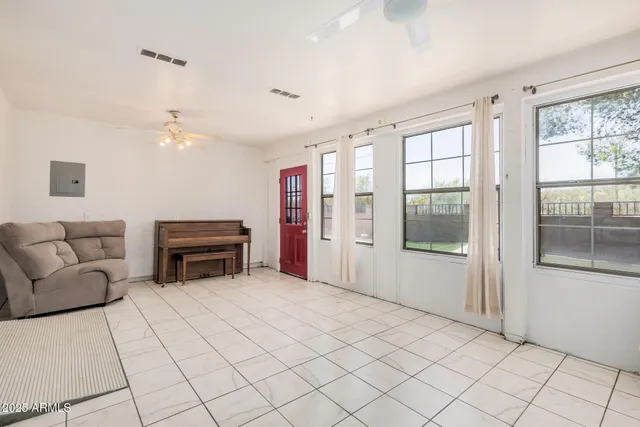 a view of a house with backyard and trees