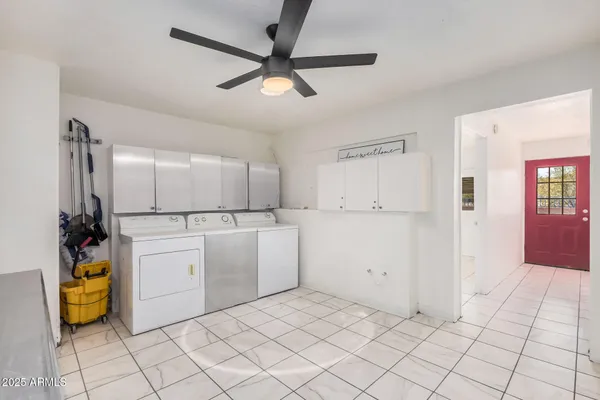 a view of a terrace with a table and chairs with wooden fence