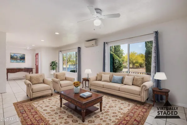 a large white kitchen with cabinets