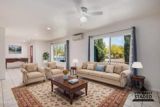 a large white kitchen with cabinets