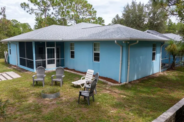 a kitchen with granite countertop a sink a stove and cabinets