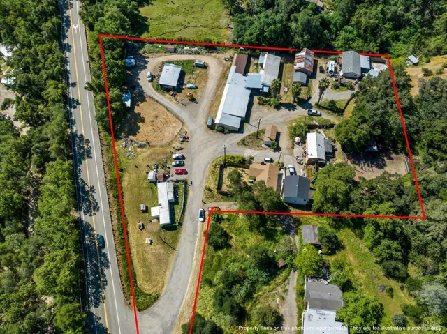 an aerial view of a house with outdoor space