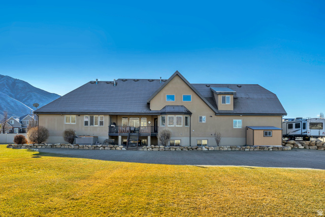 896 West 675 South Mapleton, UT 84664 - Photo 59 of 77 Rear view of property featuring stairway, a yard, a deck with mountain view, and stucco siding
