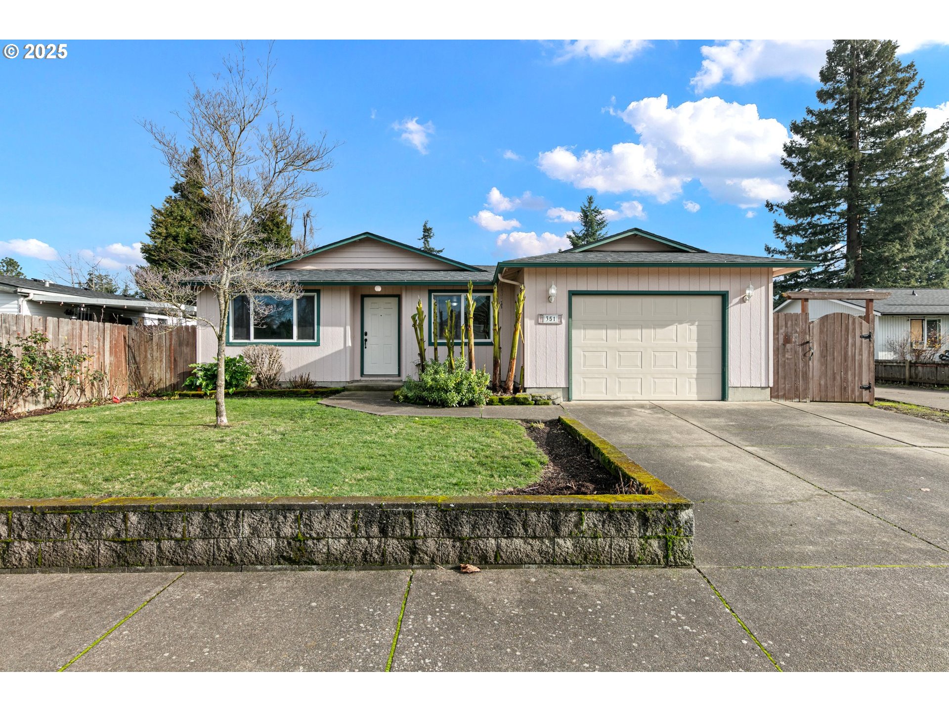 351 South 37th Place Springfield, OR 97478 - Photo 1 of 39 a front view of a house with a yard