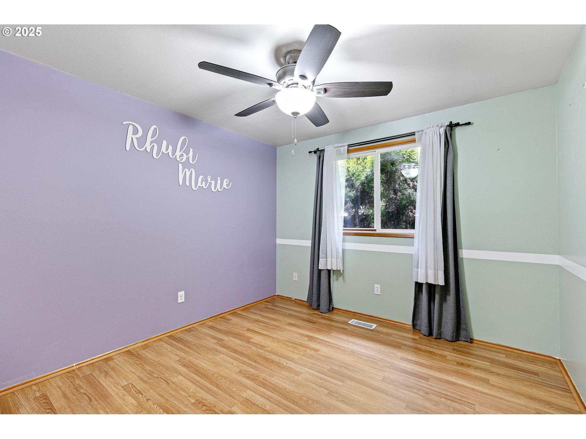 351 South 37th Place Springfield, OR 97478 - Photo 20 of 39 a view of an empty room with wooden floor and a window