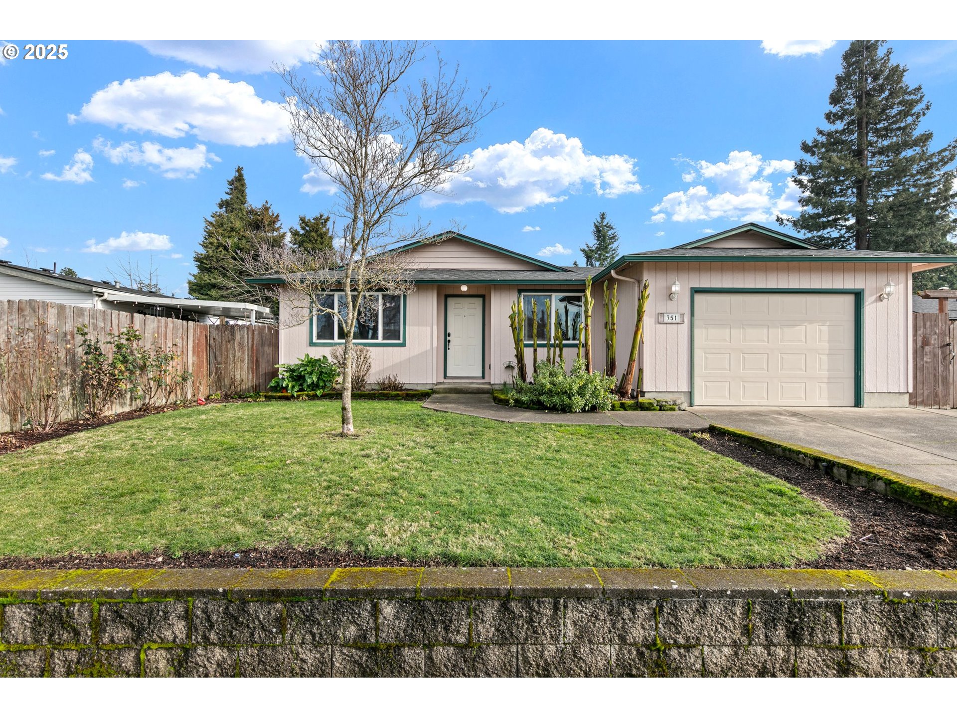 351 South 37th Place Springfield, OR 97478 - Photo 2 of 39 a view of a house with backyard and garden