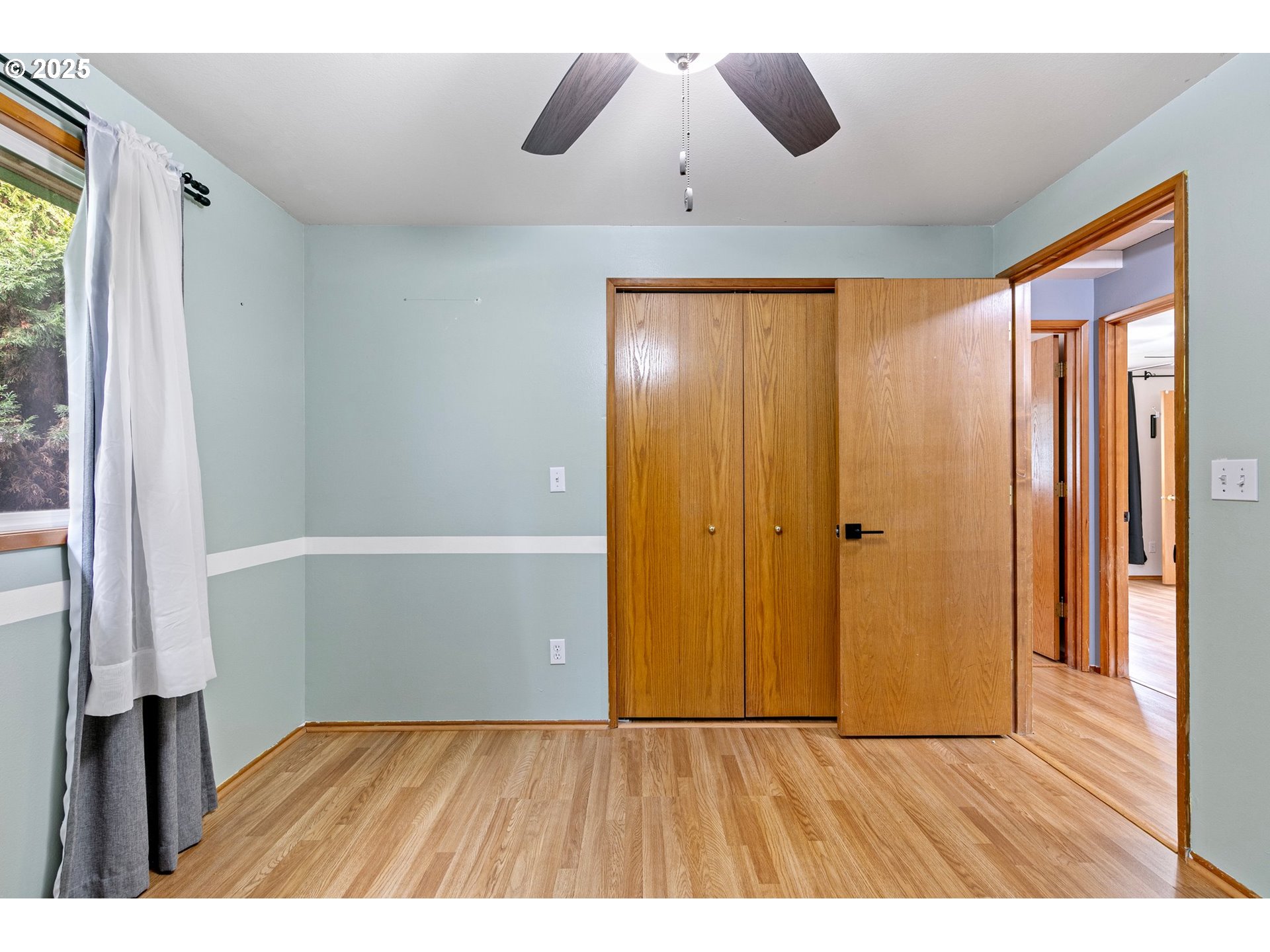 351 South 37th Place Springfield, OR 97478 - Photo 21 of 39 a view of an empty room with wooden floor and a window