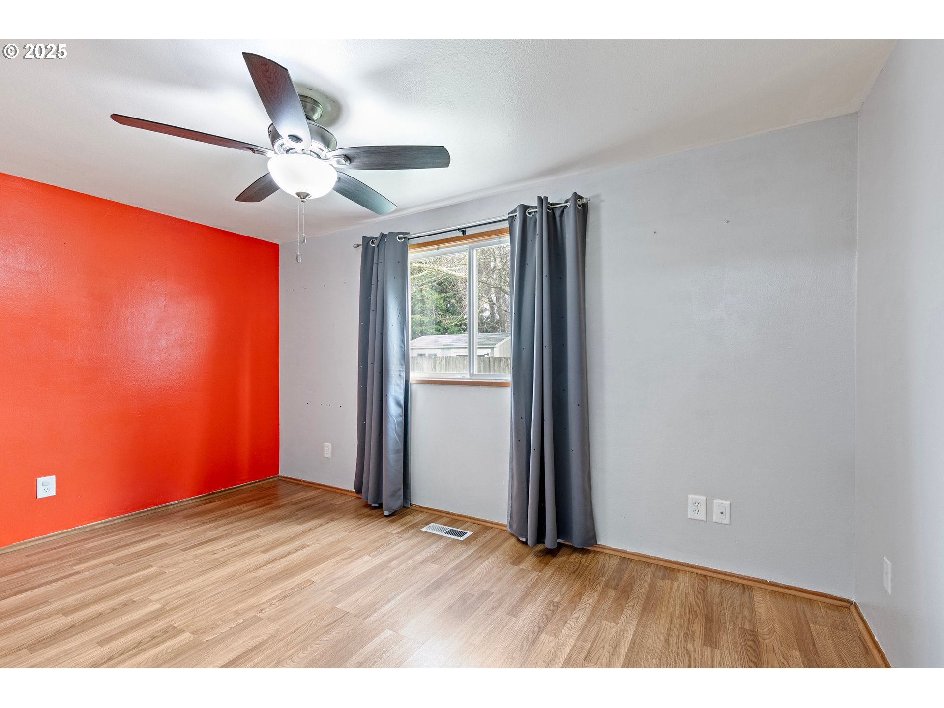 351 South 37th Place Springfield, OR 97478 - Photo 24 of 39 a view of an empty room with window and wooden floor