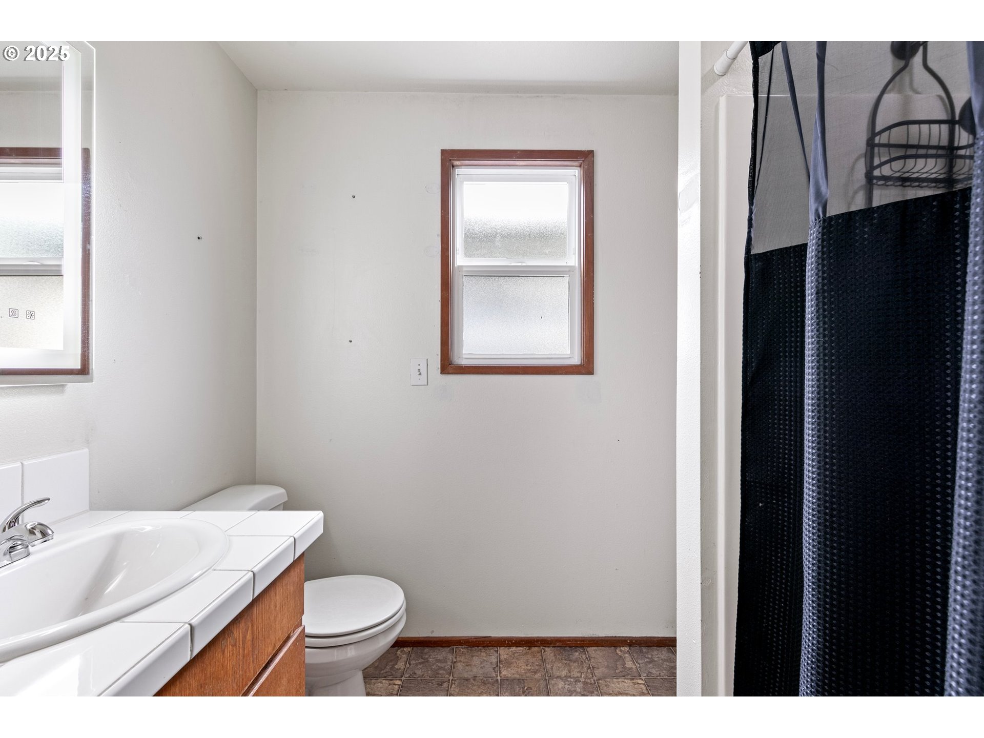 351 South 37th Place Springfield, OR 97478 - Photo 29 of 39 a bathroom with a granite countertop sink toilet and shower