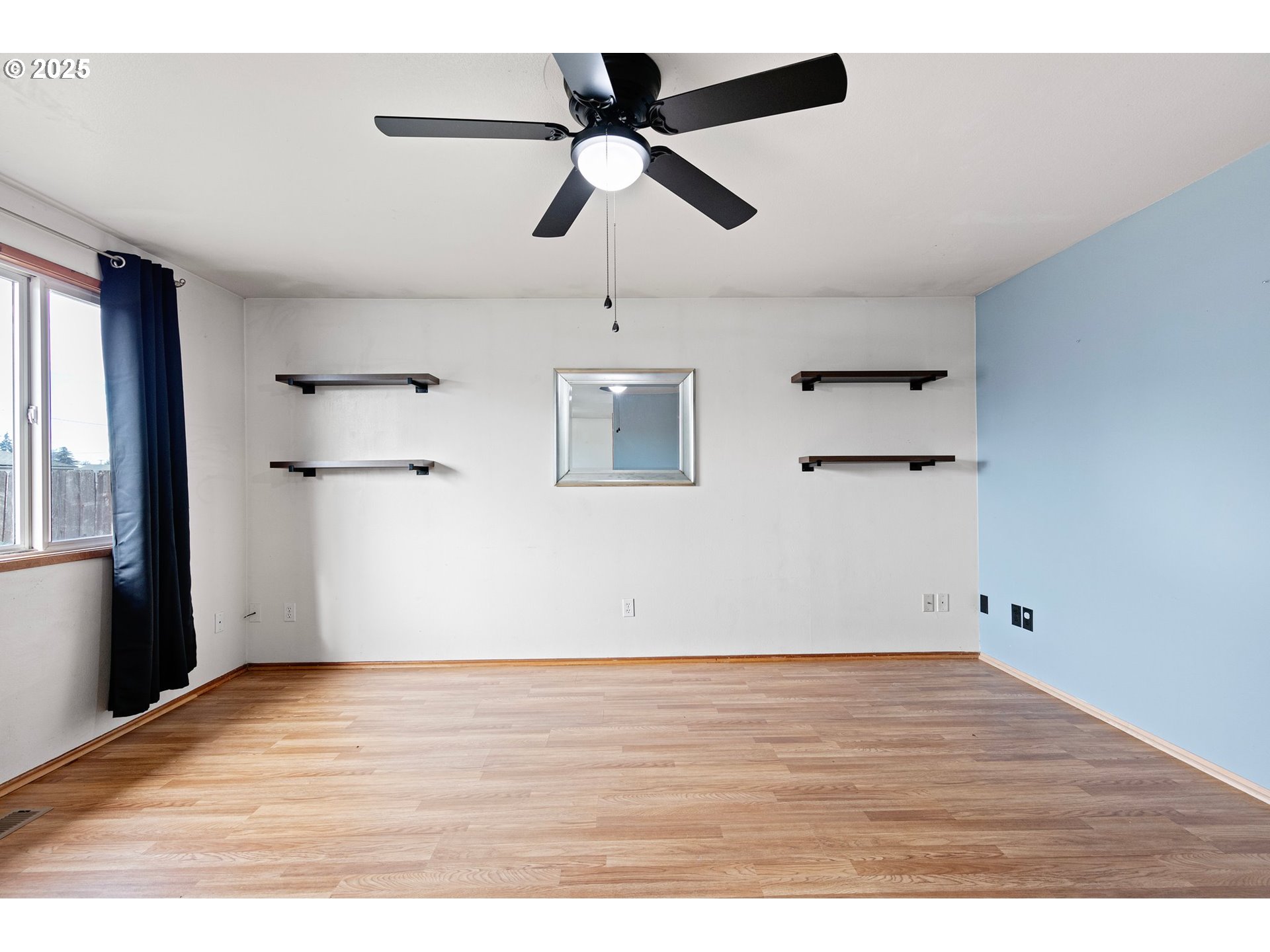 351 South 37th Place Springfield, OR 97478 - Photo 6 of 39 a view of empty room with wooden floor