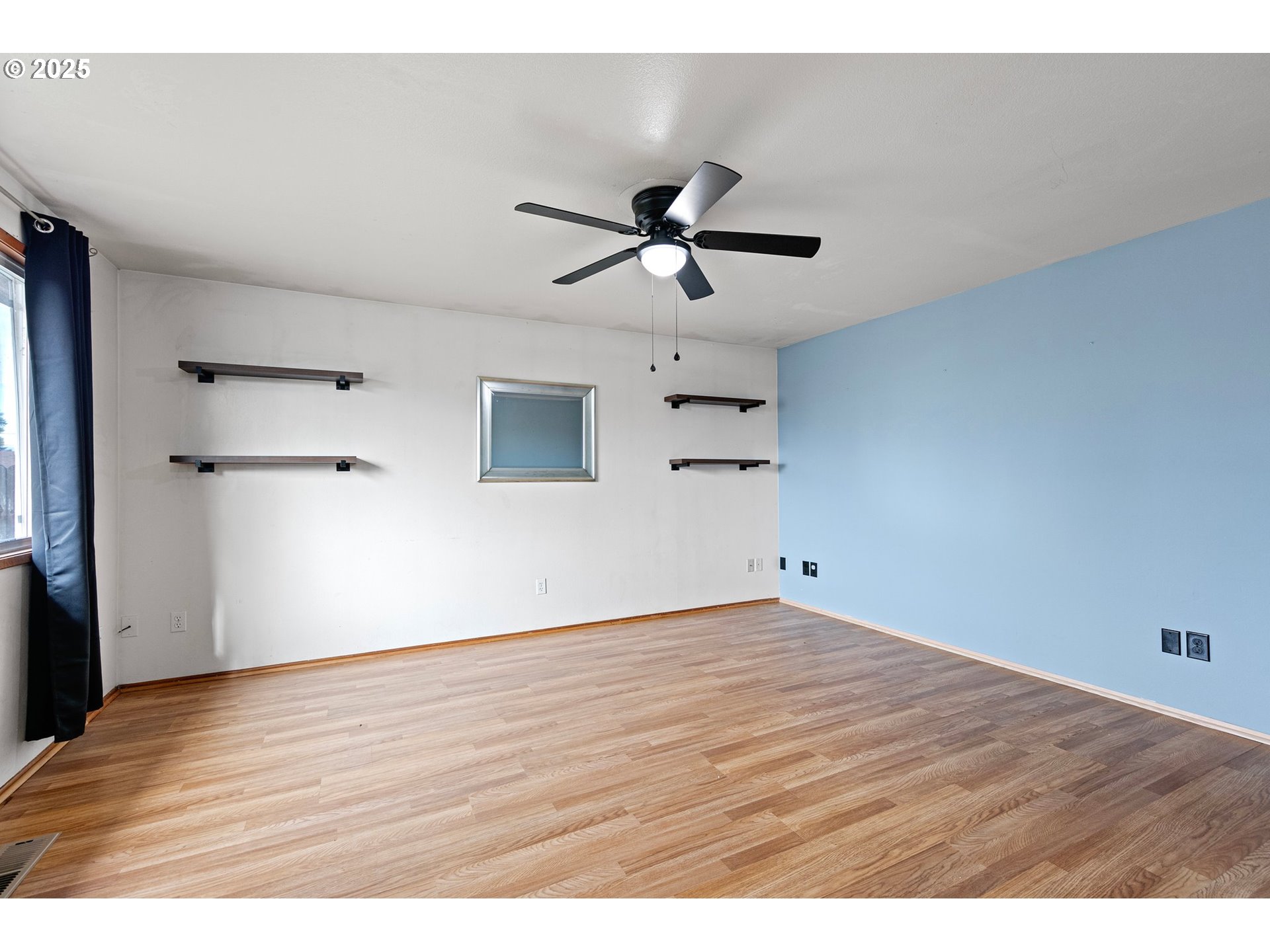 351 South 37th Place Springfield, OR 97478 - Photo 8 of 39 a view of an empty room with wooden floor