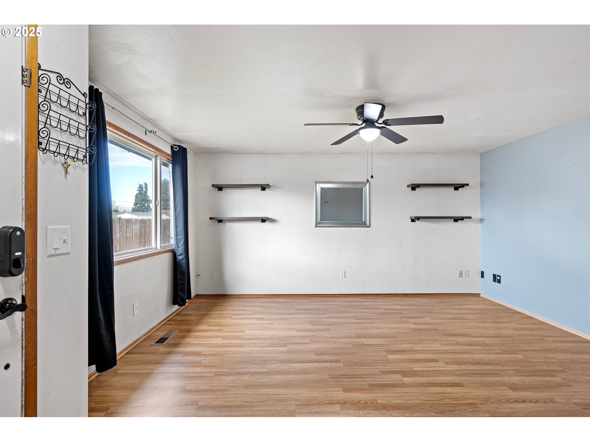 351 South 37th Place Springfield, OR 97478 - Photo 10 of 39 a view of an empty room with a ceiling fan