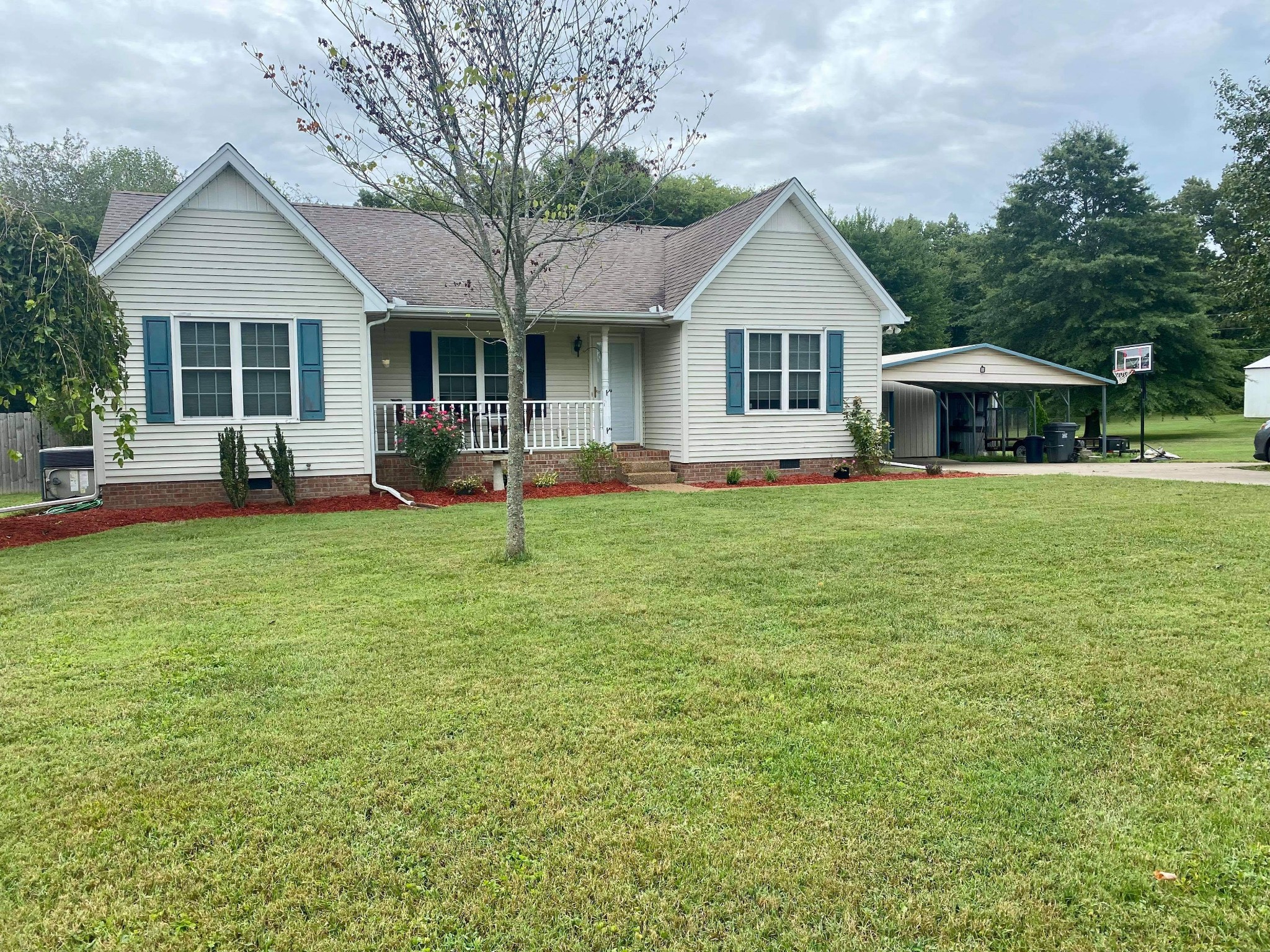 372 North Centerpoint Road Portland, TN 37148 - Photo 1 of 1 a front view of a house with a yard and trees