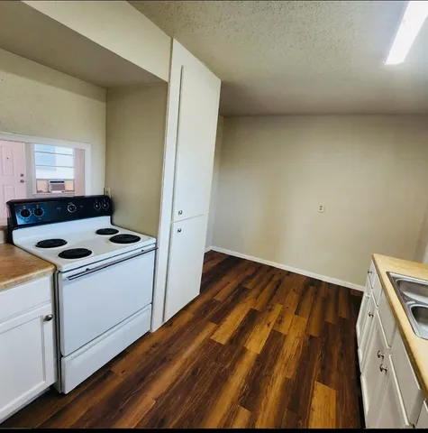 a view of kitchen with wooden floor