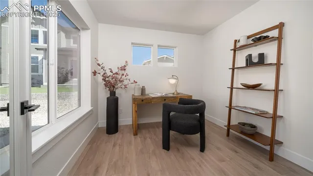 a dining room with furniture and wooden floor