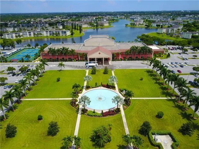 an aerial view of a pool yard swimming pool and outdoor seating