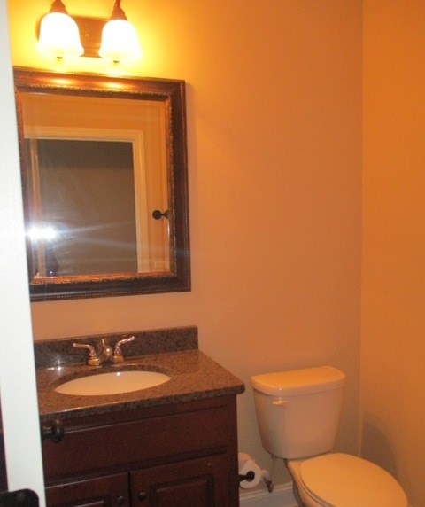 3521 Edgewood Road Columbus, GA 31907 - Photo 13 of 16 a bathroom with a toilet a sink and mirror