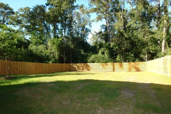 a view of a swimming pool with a yard