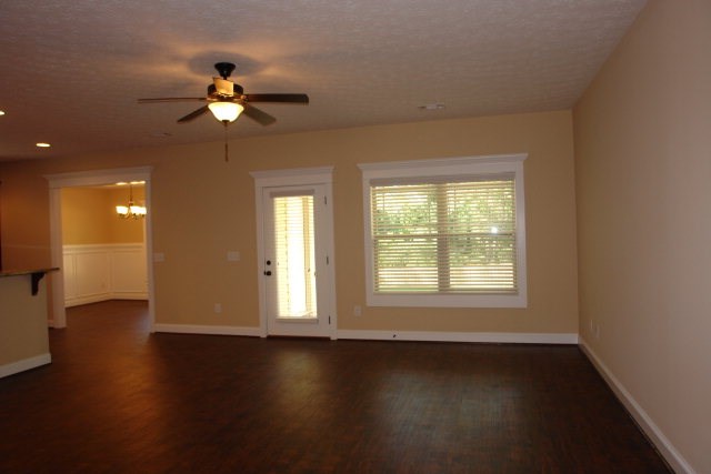 3521 Edgewood Road Columbus, GA 31907 - Photo 2 of 16 a view of an empty room with a window and wooden floor