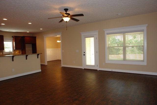 3521 Edgewood Road Columbus, GA 31907 - Photo 3 of 16 a view of a livingroom with a hardwood floor and a ceiling fan