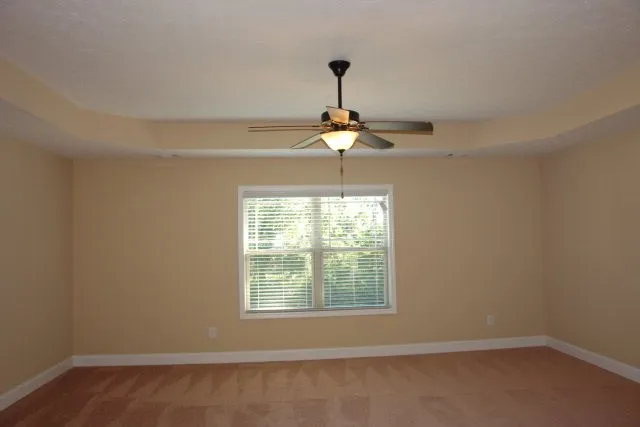 a view of a room with a window and chandelier
