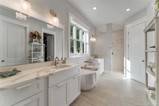 a living room with a couch and a book shelf