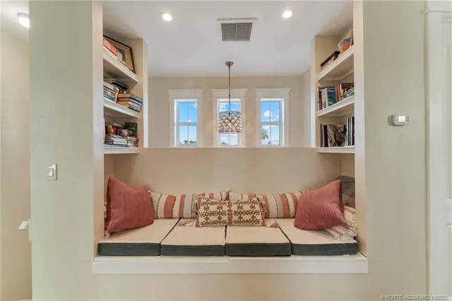 a bathroom with a bathtub shower sink vanity mirror and toilet
