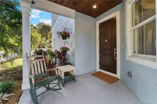 a view of a livingroom with furniture window and wooden floor