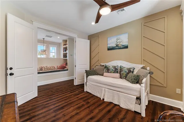 a kitchen with stainless steel appliances granite countertop a sink and wooden floor