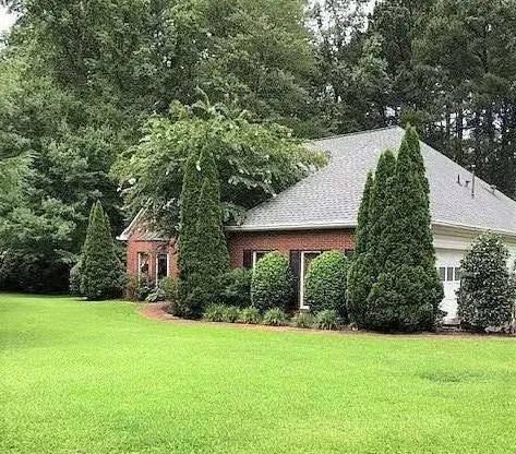 a view of a house with a yard