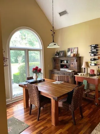 a view of a dining room with furniture window and outside view