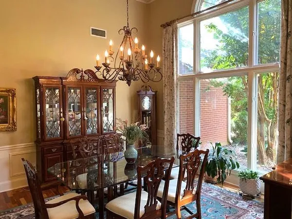 a view of a dining room with furniture window and outside view