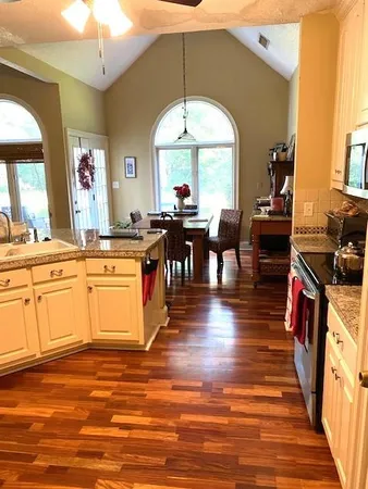 a very nice looking kitchen with wooden floor