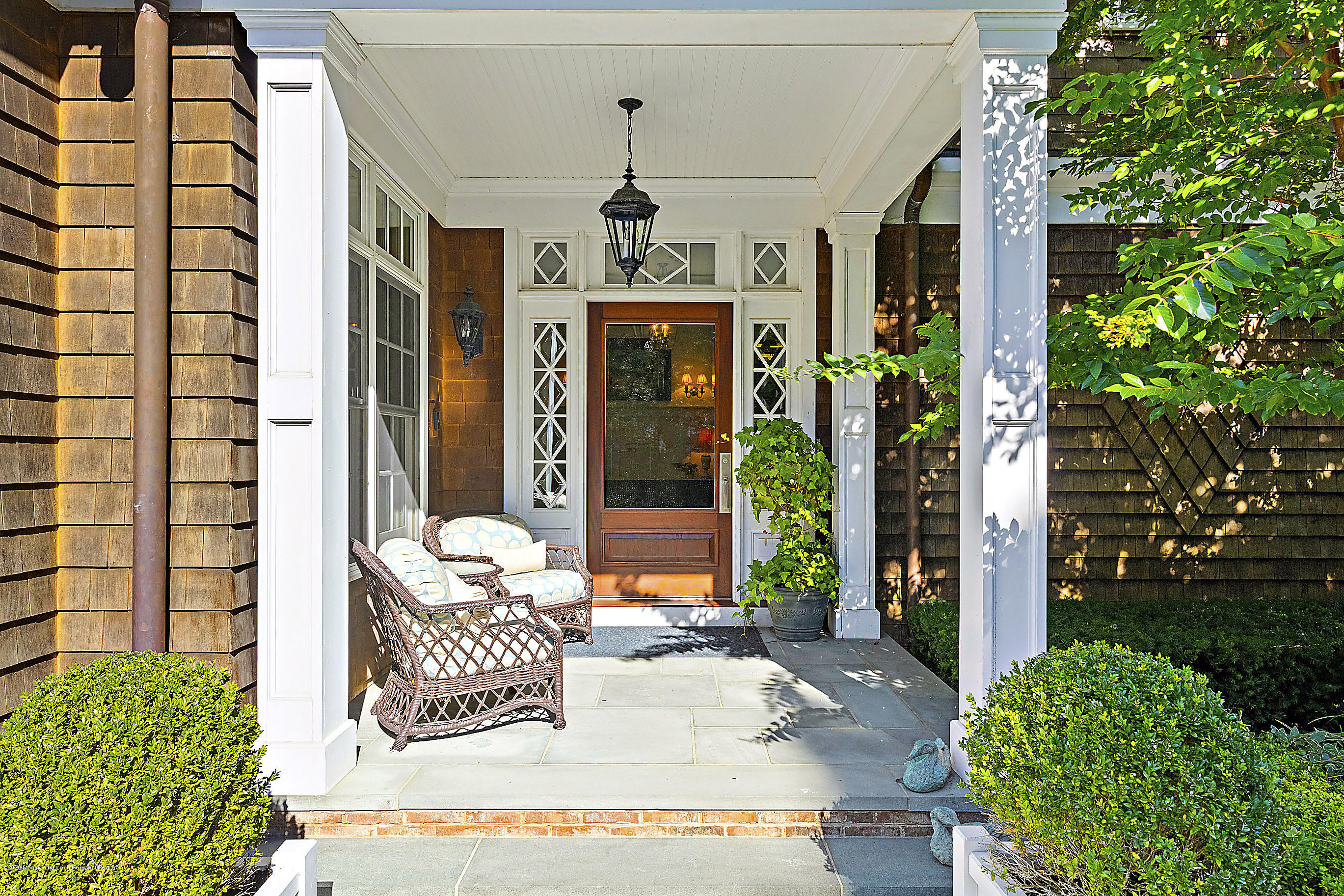 62 River Road Rumson, NJ 07760 - Photo 13 of 54 a front view of a house with a porch
