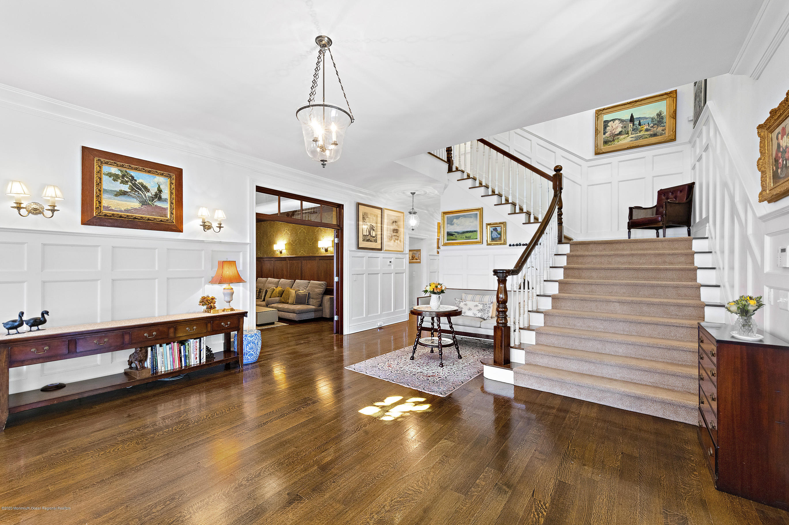 62 River Road Rumson, NJ 07760 - Photo 15 of 54 a view of a livingroom with furniture wooden floor and staircase