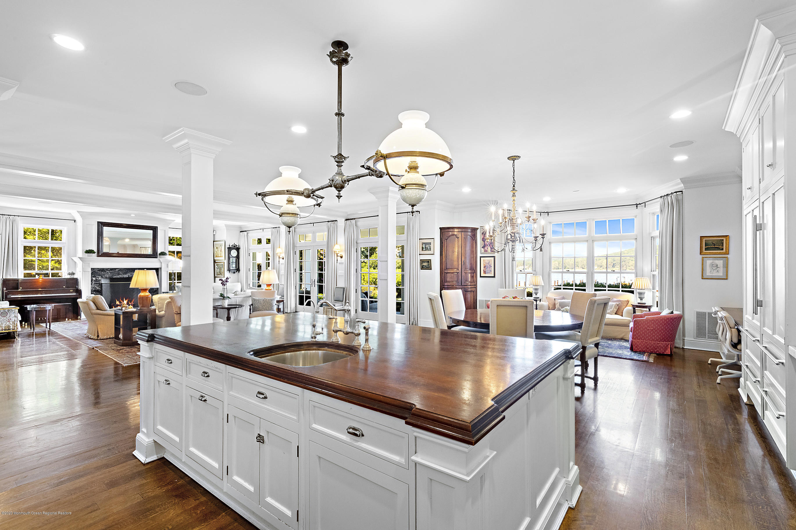 62 River Road Rumson, NJ 07760 - Photo 19 of 54 an open kitchen with granite countertop a stove and living room view