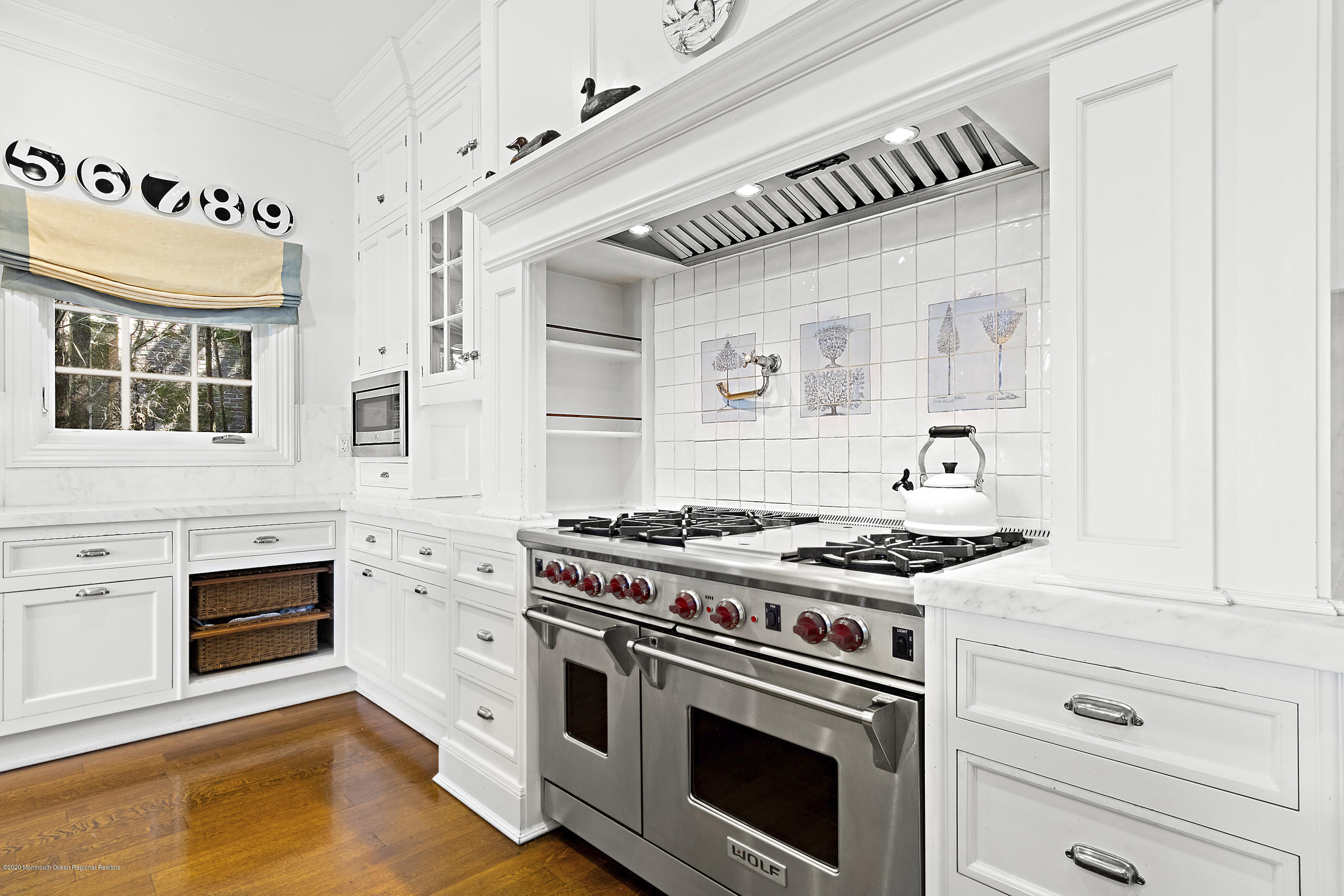 62 River Road Rumson, NJ 07760 - Photo 20 of 54 a kitchen with granite countertop a stove and a sink